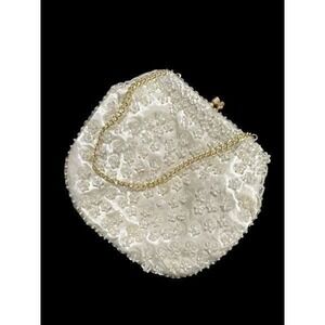 This gorgeous Vintage Handmade Purse! It is beaded and has a nice weight to it.